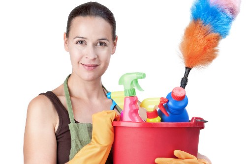 Carpet cleaner preparing equipment with safety focus in a Thamesmead property